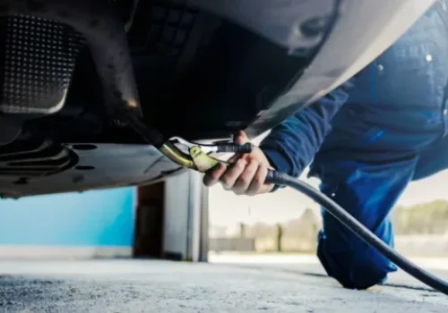 close-up-of-a-auto-mechanic-measuring-exhaust-gases-on-a-car-at-picture-id1386424980